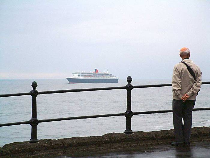Queen Mary 2 cruising past King Edwards Bay Tynemouth towards Edinburgh. 12 july 2004